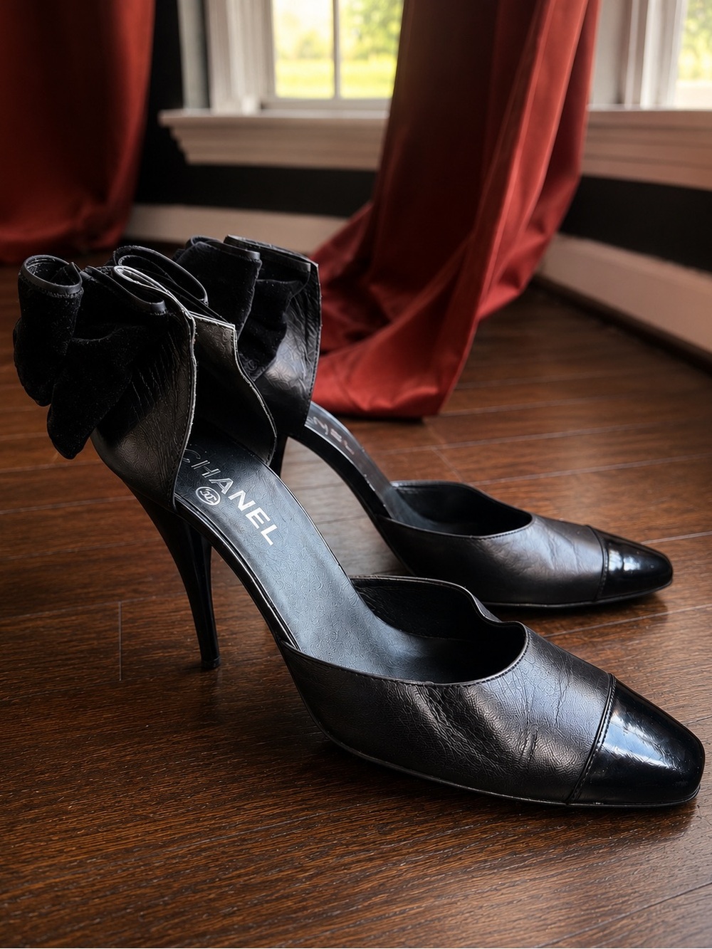 CHANEL Black Leather Pointed-Toe Heels with Ankle Bow Detail